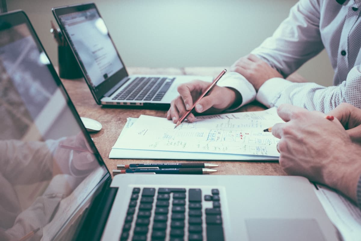 Business professionals reviewing insurance documents